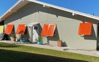 Orange Bahama Shutters | West Shore Construction