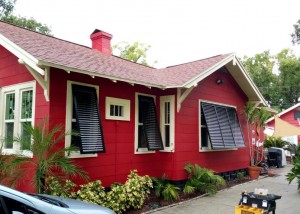 Red House with Black Bahama Shutters | West Shore Construction