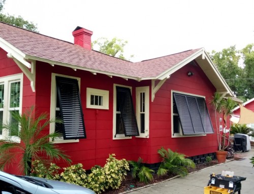 Red House with Black Bahama Shutters