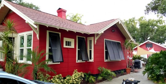 Red House with Black Bahama Shutters | West Shore Construction